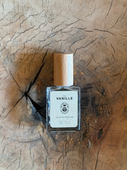 Perfume bottle labeled 'Vanille' on a wooden surface