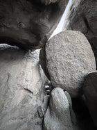 Close-up of large rock formations with a small person for scale