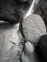 Close-up of large rock formations with a small person for scale