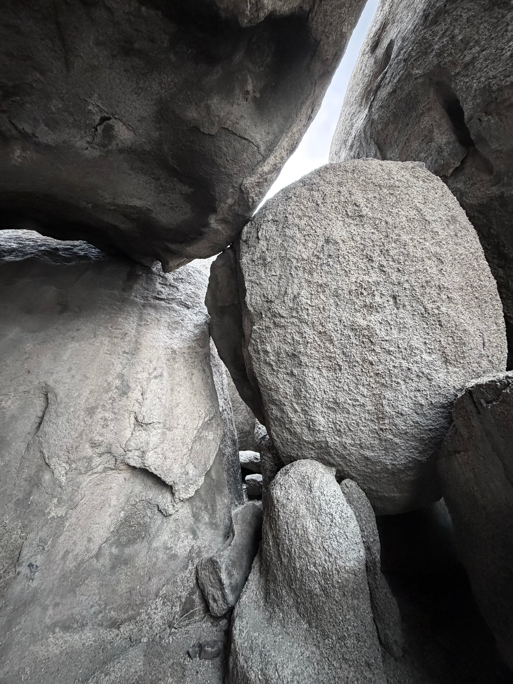 Close-up of large rock formations with a small person for scale