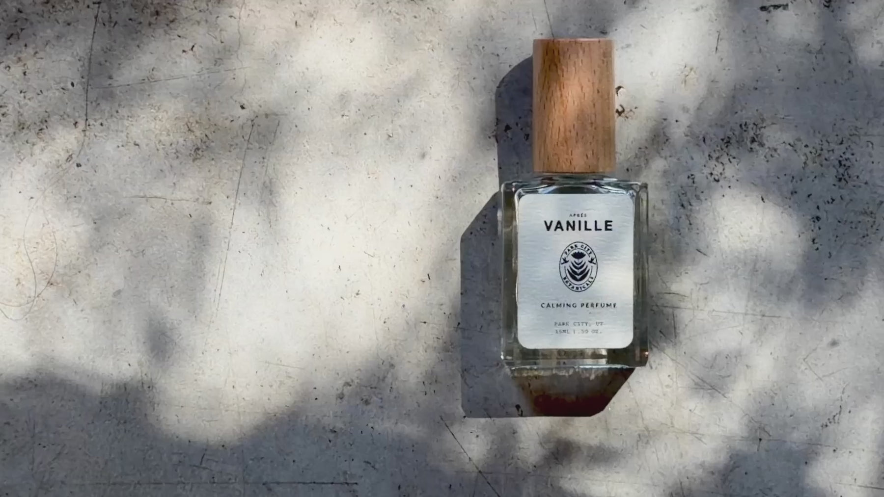 Bottle of Park City Botanicals perfume Vanille against a rock background